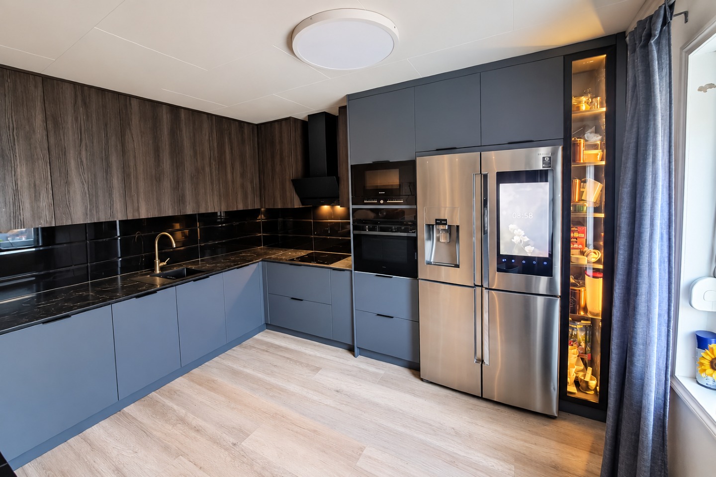 Zoré Home kitchen with dark cabinetry, wood finishes and warm display lighting